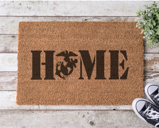 Coir doormat with the word ‘Home’ featuring the Marine Corps emblem as the letter O, hand-painted in a bold military-inspired design