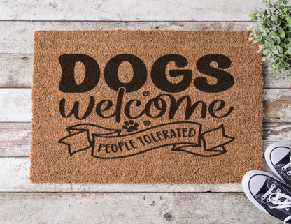 Coir doormat with the phrase ‘Dogs Welcome, People Tolerated,’ hand-painted in bold lettering with a playful, pet-friendly vibe