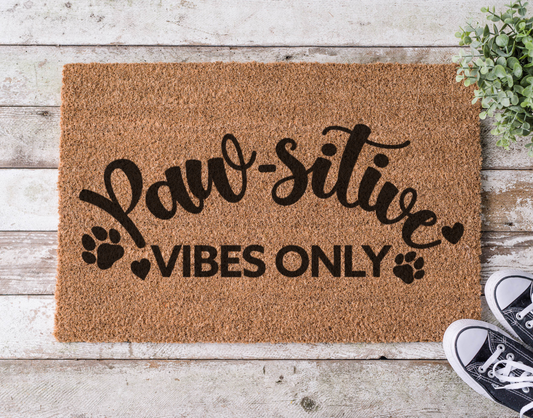Coir doormat with the phrase ‘Paw-sitive Vibes Only,’ hand-painted with paw prints in a cheerful, pet-friendly design