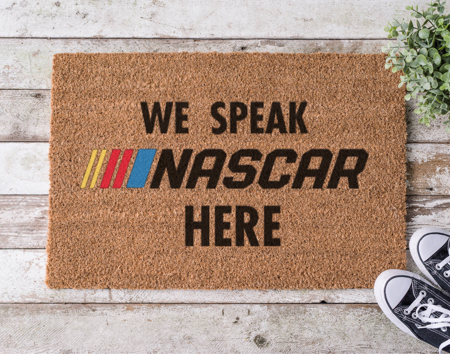 Coir doormat with the phrase ‘We Speak Racing Here,’ hand-painted in bold, motorsport-inspired lettering