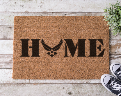 Coir doormat with the word ‘Home’ featuring the U.S. Air Force logo as the letter O, hand-painted in bold black 