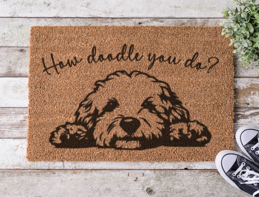 Coir doormat with the phrase ‘How Doodle You Do?’ hand-painted in playful lettering with a dog-inspired design